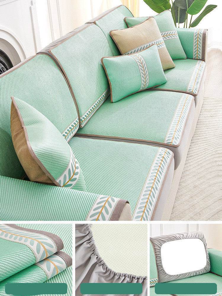 Non slip sandwich sofa cover in solid green color on beige sofa